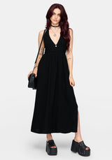 Woman wearing a black dress with a white background