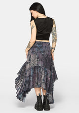 Woman wearing a black lace-up top with intricate designs on a plain background