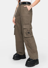 Woman wearing brown cargo pants on a white background