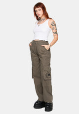 Woman wearing brown cargo pants on a white background