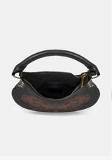 Black handbag with embroidered patterns on a white background