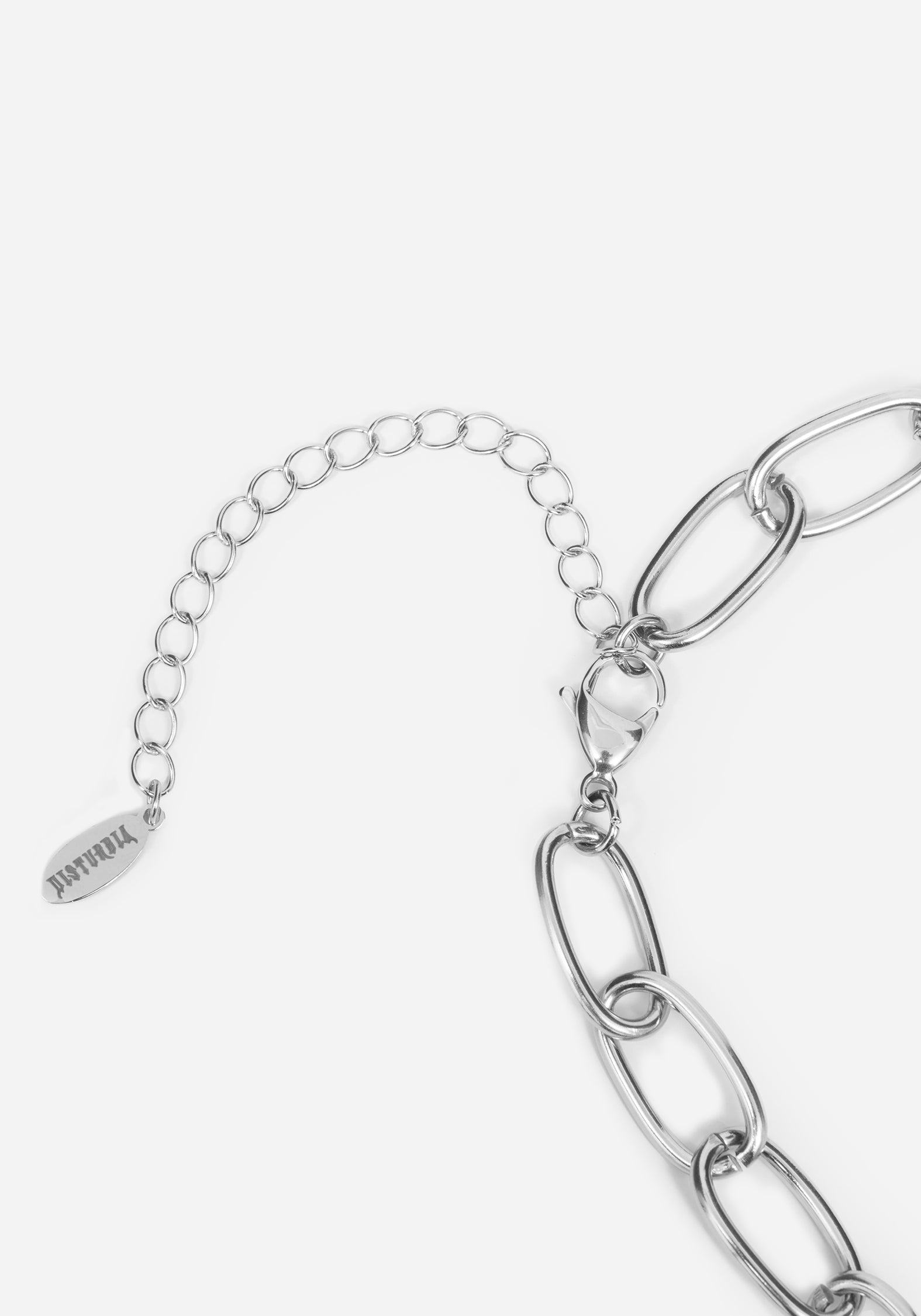 Silver chain link bracelet featuring a chunky oval link chain, a delicate extender chain, and a small engraved tag that reads 'DISTURBIA'.