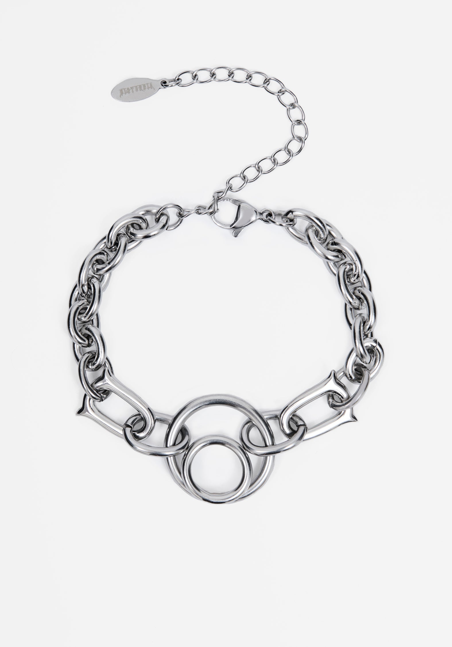 A silver-toned chain bracelet featuring a central interlocking circular link motif and an adjustable extender chain with a branded tag, shown on a light gray background.