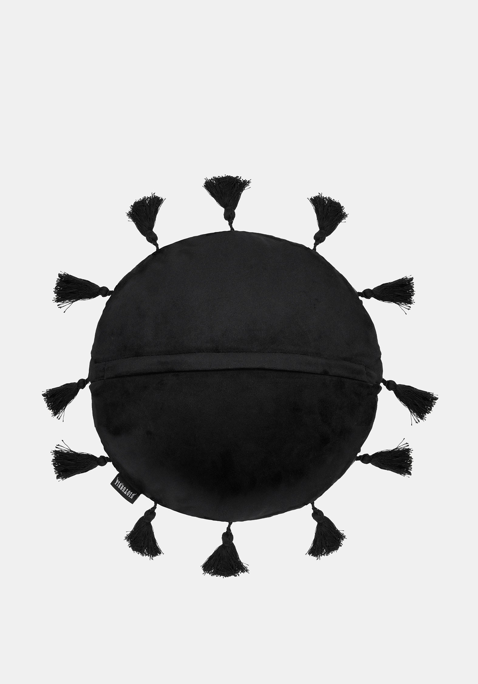 A black round decorative pillow with tassels around the edge, shown against a light gray background.