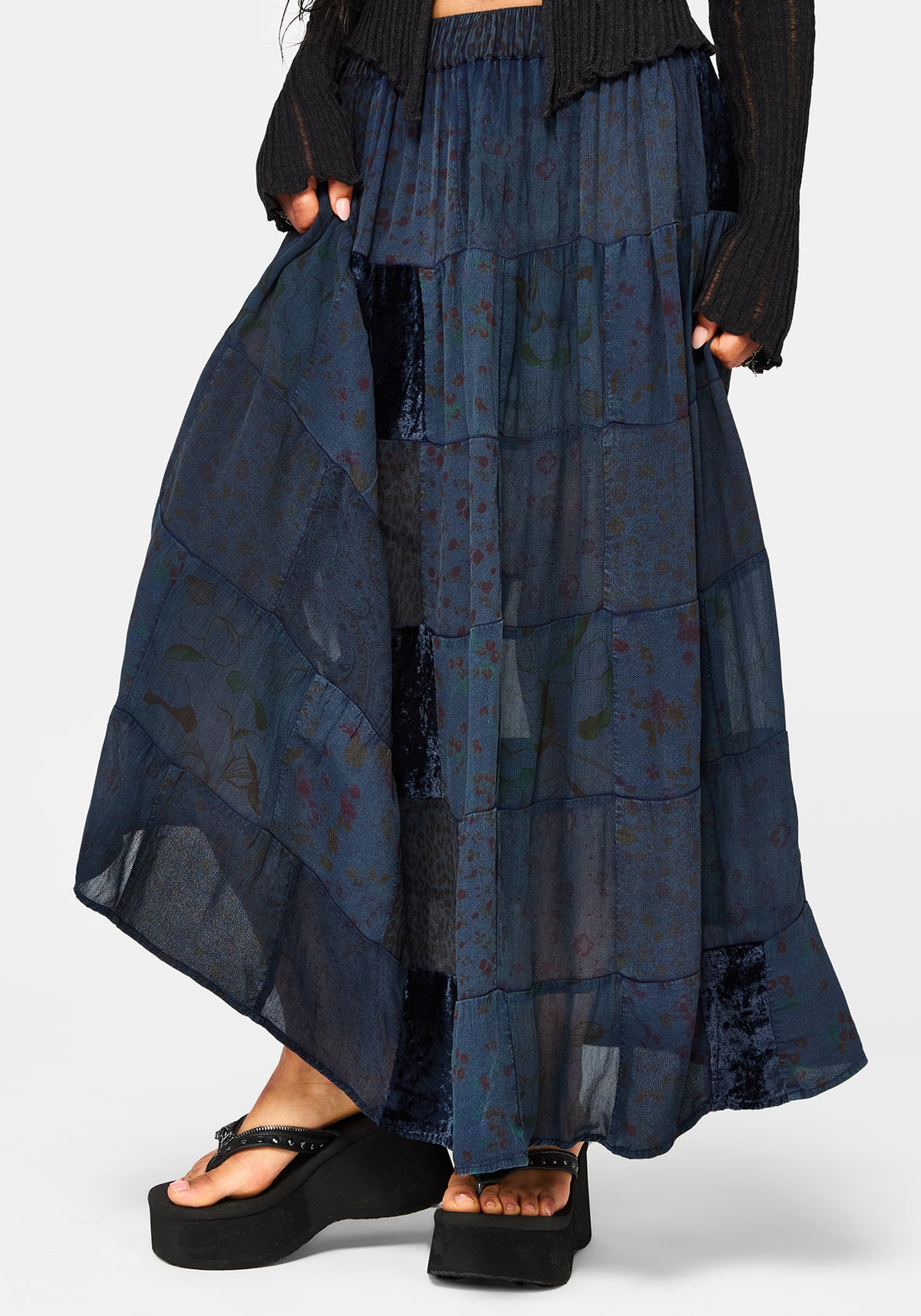 Navy blue patchwork skirt worn by a model on a white background
