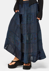 Navy blue patchwork skirt worn by a model on a white background