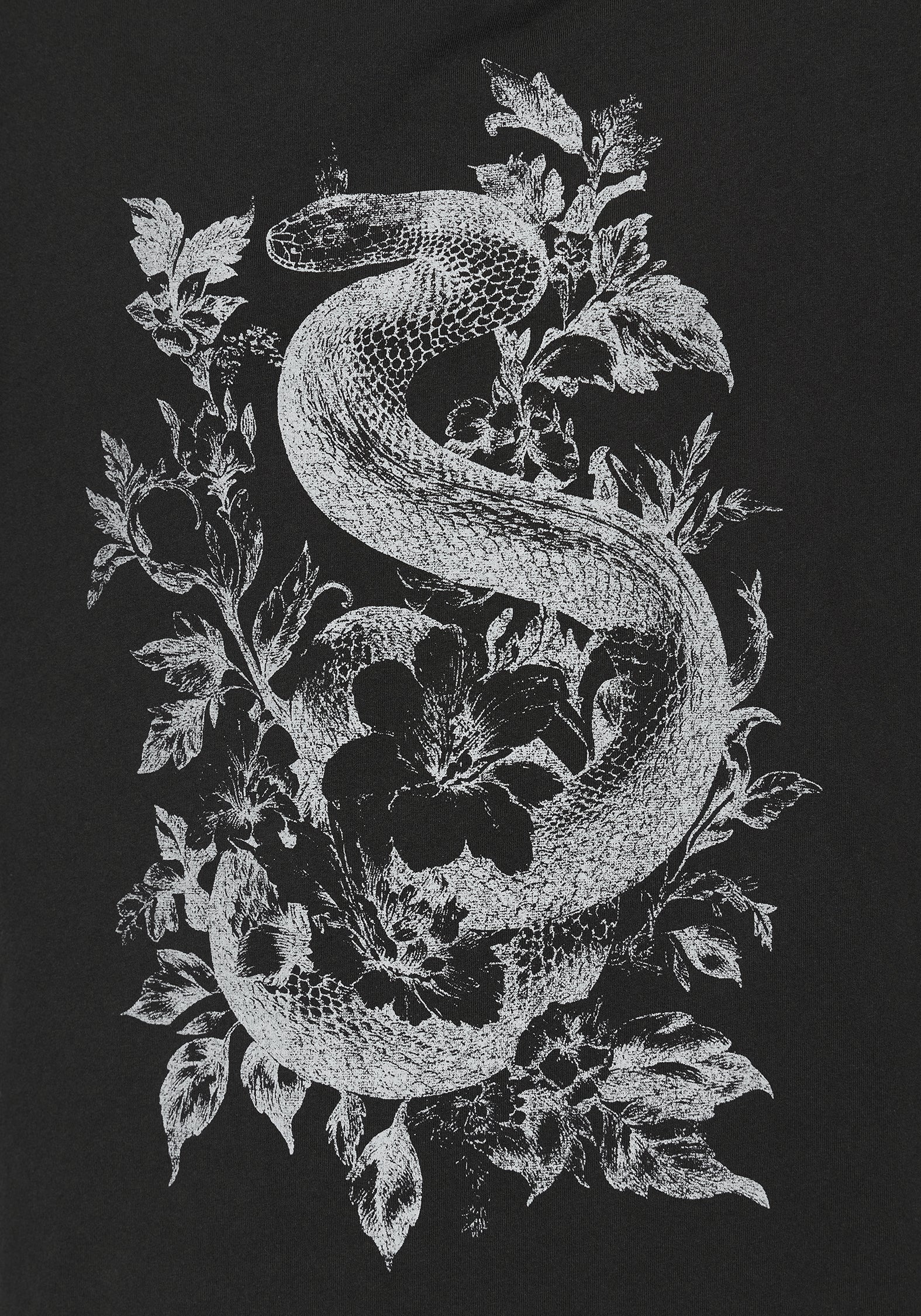 A black t-shirt featuring a detailed white graphic print of a coiled snake wrapped through leaves and flowers.