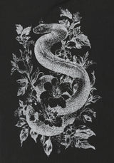 A black t-shirt featuring a detailed white graphic print of a coiled snake wrapped through leaves and flowers.